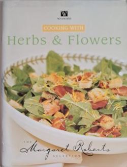 Front cover of Cooking with Herbs & Flowers - The Margaret Roberts Selection, showing a vibrant herb salad in a white bowl. Photo by Karin's Treasures.